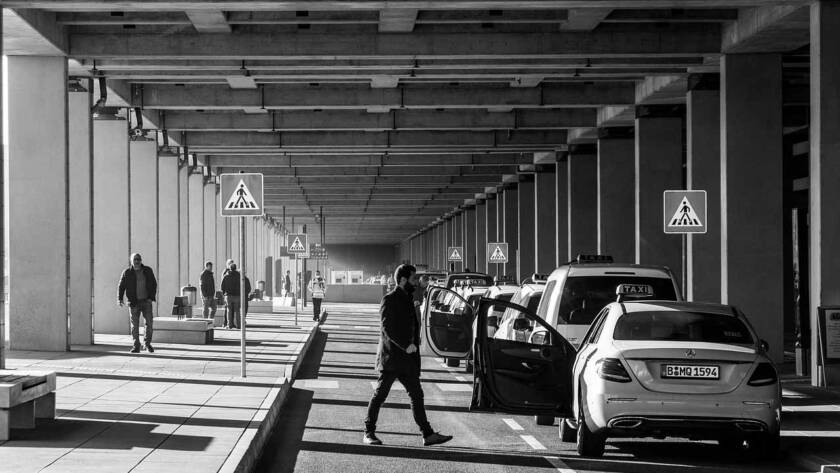 White Mercedes-Benz S-Class parked curbside, ready for an airport transfer from Heathrow to Carshalton